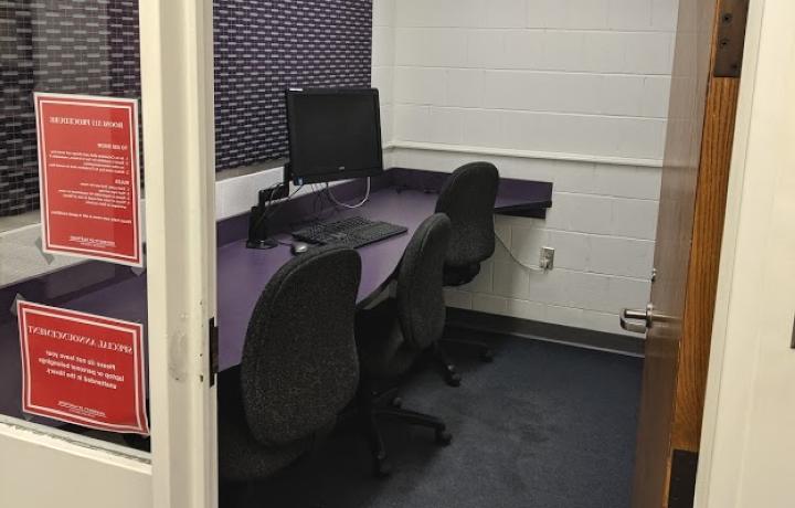 Inside view of room 311 with computer and chairs